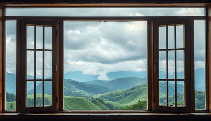 A serene view of rolling green hills and distant mountains seen through a large window with a cloudy sky