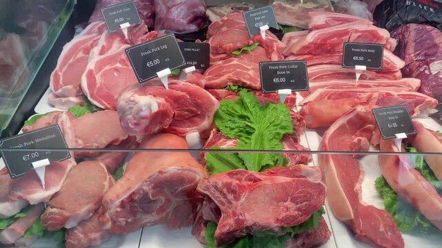 Pork meat display in butcher shop. High quality 4k footage