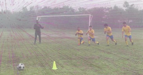 Coach signaling soccer warm-up drill on grass, guiding players shifting kneel to sprint past cone - Powered by Adobe