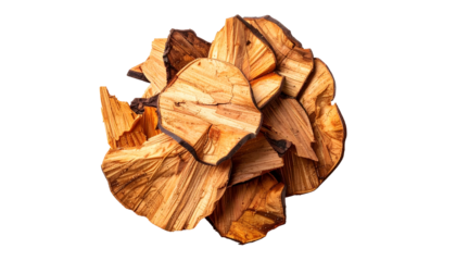 Pile of wood chunks with dark edges on black background