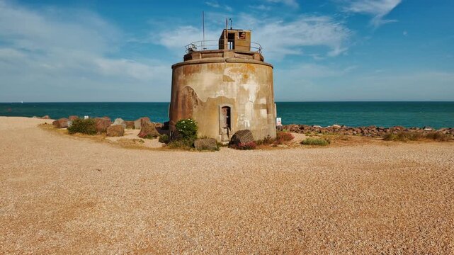 Martello Tower, Eastbourne, East Sussex, England, UK, built in the beach during the Napoleonic Wars, with round walls, low battlements and sturdy masonry
