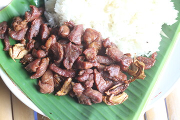 Fried pork with garlic and sticky rice