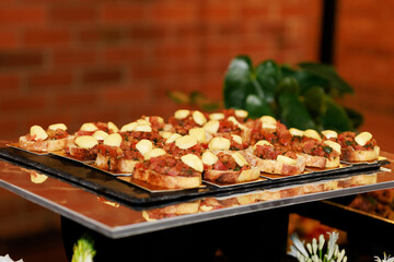 French Bread Bruschetta Appetizers with Tomato and Vegetables on Catering Display Trays