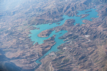 Aerial View of Rugged Desert Mountain Range with Dramatic Peaks and Valleys