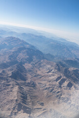 Aerial View of Rugged Desert Mountain Range with Dramatic Peaks and Valleys