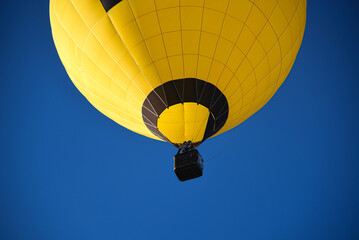 Balloons taking off into the blue sky
