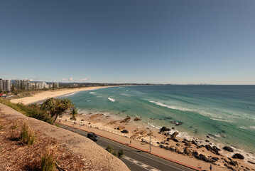 Kirra Beach from the top of Kirra Point, Queensland, Australia. The skyscrapers of the Sunshine Coast on the horizon in the distance.