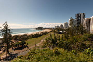 View from Kirra Point of Coolangatta and Greenmount Beaches backed by the high-rises of Coolangatta, under a clear, blue sky. Coolangatta, Gold Coast, Queensland, Australia.	