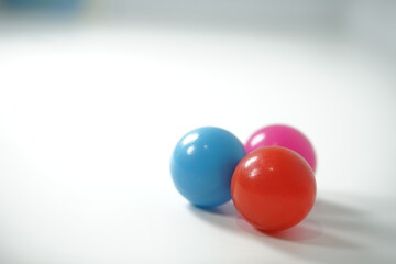 Primary colored spheres create a playful and vibrant composition in studio