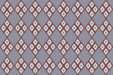This fabric shows a geometric diamond pattern in brown and white on a gray background, with each diamond containing smaller floral-like motifs for a traditional look.
