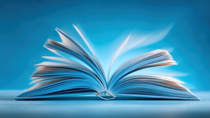 An open book with pages fluttering in the wind on a blue background.