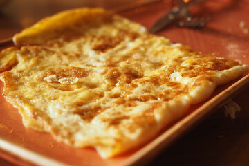 Delicious omelette egg served on a warm plate
