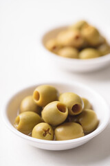 Fresh olives pickled on white background
