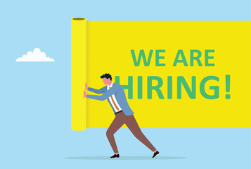 Vector illustration of a businessman pushing a big yellow banner with text we are hiring, representing job vacancy announcement and recruitment concept
