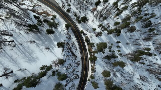 Angeles Crest Highway at Snowcrest Aerial Shot of Winter Snow Forest Follow Road California USA