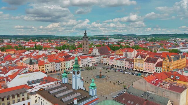 Discover the charm of Česk&eacute; Budějovice with this stunning aerial footage showcasing the historic Old Town Square, colorful Baroque merchant houses, the iconic Black Tower, and the majestic Samson Foun