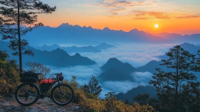 Bikepacking adventure with a stunning mountain view at sunrise.