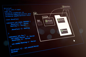 Close-up of software development diagram with PlantUML code on dark screen. Ideal for illustrating object-oriented programming, system design, and tech documentation.