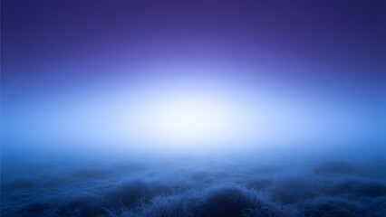 A mystical blue fog covered field with light shining through