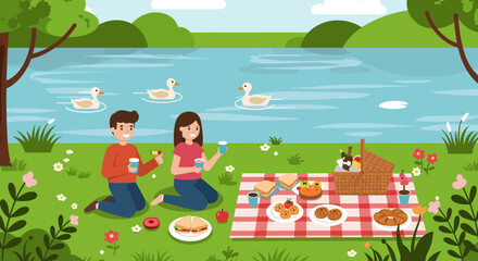 Couple enjoying picnic by the lake with ducks