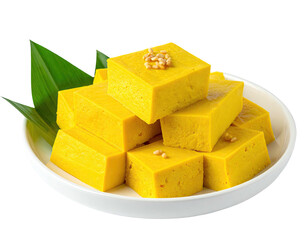 Golden-yellow, cubed dessert on a plate
