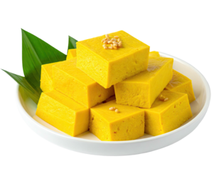 Golden-yellow, cubed dessert on a plate