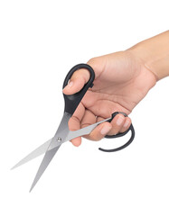 Hand holding a pair of scissors.  Scissors held in a person's hand, blades open,  black handles,  isolated on a dark background