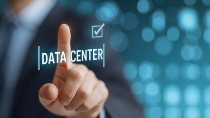 Businessman Touching Virtual "DATA CENTER" Screen Button with Correct Icon, Neon-Blue Background, or Web Design and Online Business Concept
