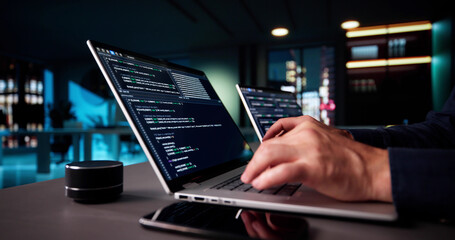 Elderly Senior Programmer Debugging Code On Multiple Laptops