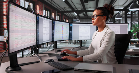 African American Woman Using Billing Software