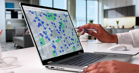 Young African American Woman Using Laptop To Search