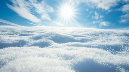 Sparkling snow under bright winter sun with clear blue sky