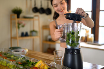 Vibrant wellness scene of a woman blending fresh vegetables for a healthy lifestyle, Focus on blender