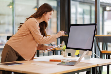 Asian woman doing financial accounting and taxes for a company Organizing account analysis reports Investment information Financial and tax system concepts
