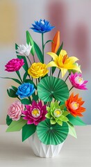 Colorful origami flowers in a white vase displaying various floral paper art designs