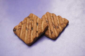 Hide and Seek chocolate biscuits are crunchy, delicious cookies loaded with rich chocolate chips, offering a perfect blend of sweetness and crunch