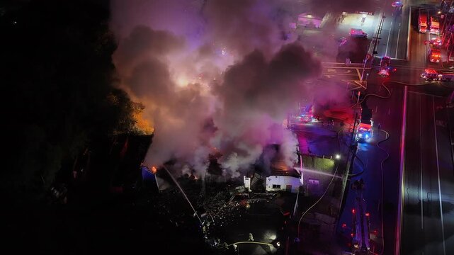 Heavy Fire and Smoke Coming from a Small Business