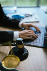 Lawyer’s desk with gavel, contract, and toy car symbolizing justice, legal judgment, insurance claim, and automobile law cases.