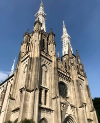 Fototapeta premium Gothic Cathedral with Tower and Stained Glass Window