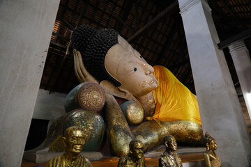 Large reclining Buddha at Wat Thammikarat in Ayutthaya, Ayutthaya Historical Park