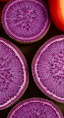 
Macro Close-Up of Sliced Purple Ube Yam and Pile of Pink-Purple Sweet Peppers – Vivid Root Vegetable Texture.close up of a pile of pink and purple sweet pepper, Macro shot of sliced purple ube yam 