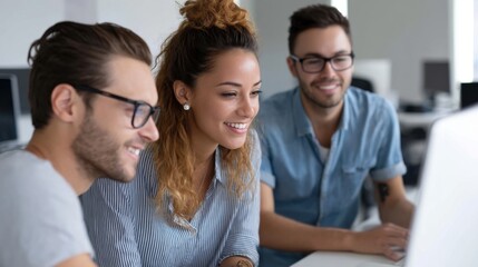Young professionals working on a digital project, collaborating and networking in a modern office. 