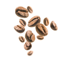 Coffee beans levitate on a white background
