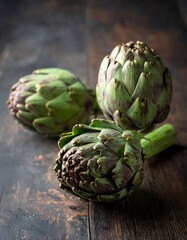 Fototapeta premium Artichokes on a Wooden Surface - Fresh and Healthy Food.