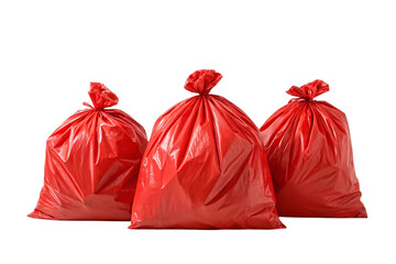 Three red plastic trash bags knotted closed full of refuse positioned together in grouped display, isolated on a transparent background