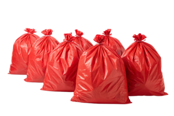 Six red garbage bags filled and knotted, arranged in overlapping formation on white background surface, isolated on a transparent background