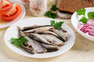 Ingredients for sandwiches with anchovies, onions, and tomatoes. Diet food. Delicious food.