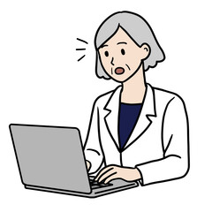 PC作業する白衣のシニア女性（驚く）