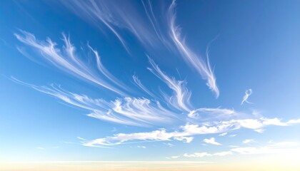 Bright blue sky with wispy, feathery cirrus clouds streaking across, offering a sense of freedom and vastness