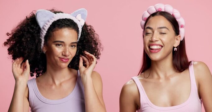 Dance, friends and women in studio for skincare, beauty and facial glow with headband for self care. Energy, movement and happy people with cosmetics, pamper and fun for bonding on pink background